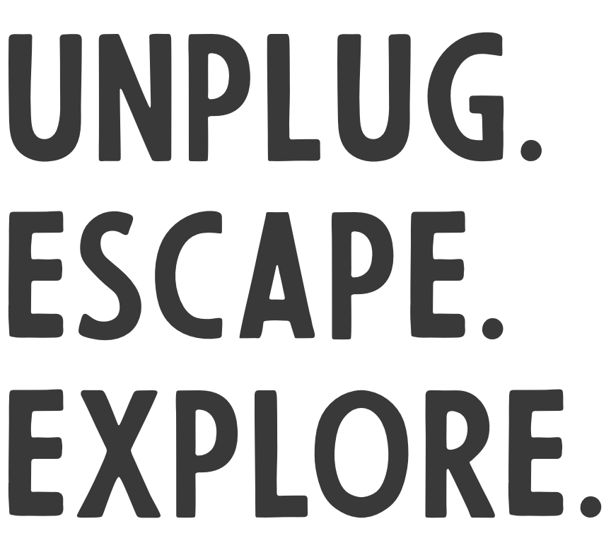 Text: Unplug. Escape. Explore.